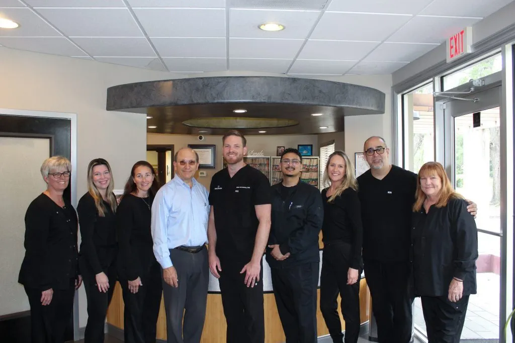 The Cardinal Point Dental team standing together in the office lobby — teeth cleanings and exams in Jacksonville, FL