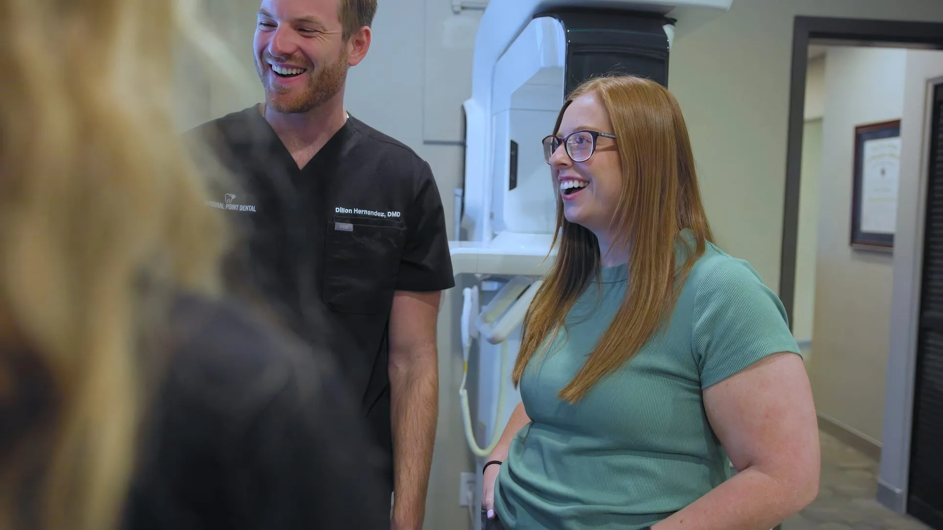 Dr. Dillon Hernandez laughing with a team member at Cardinal Point Dental, Jacksonville, FL (cosmetic bonding)