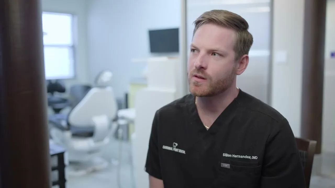 Dr. Dillon Hernandez speaking in a Cardinal Point Dental treatment room — teeth cleanings, exams and implant treatment in Jacksonville, FL