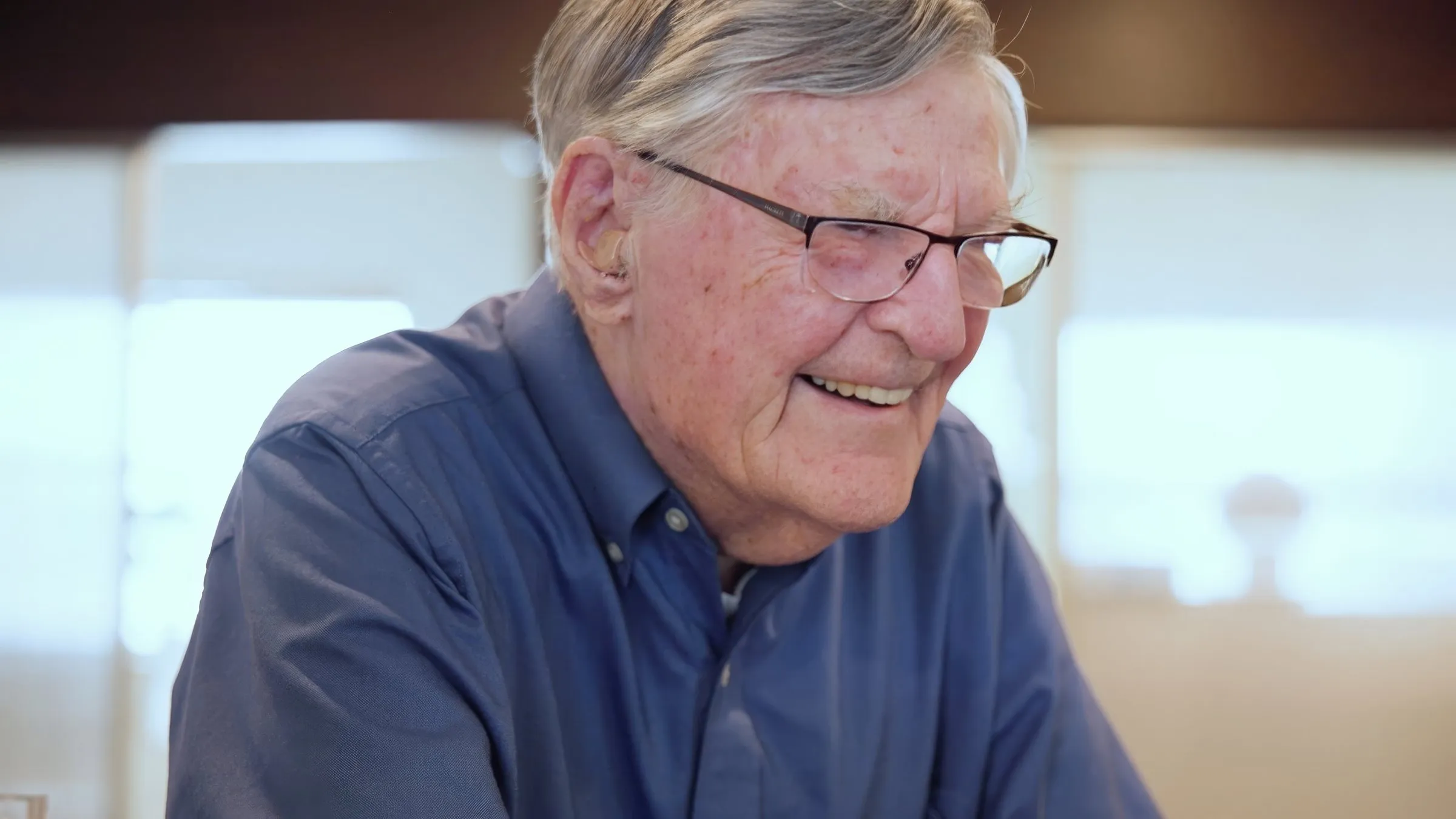 An older patient smiling during a visit at Cardinal Point Dental — Invisalign clear aligners in Jacksonville, FL