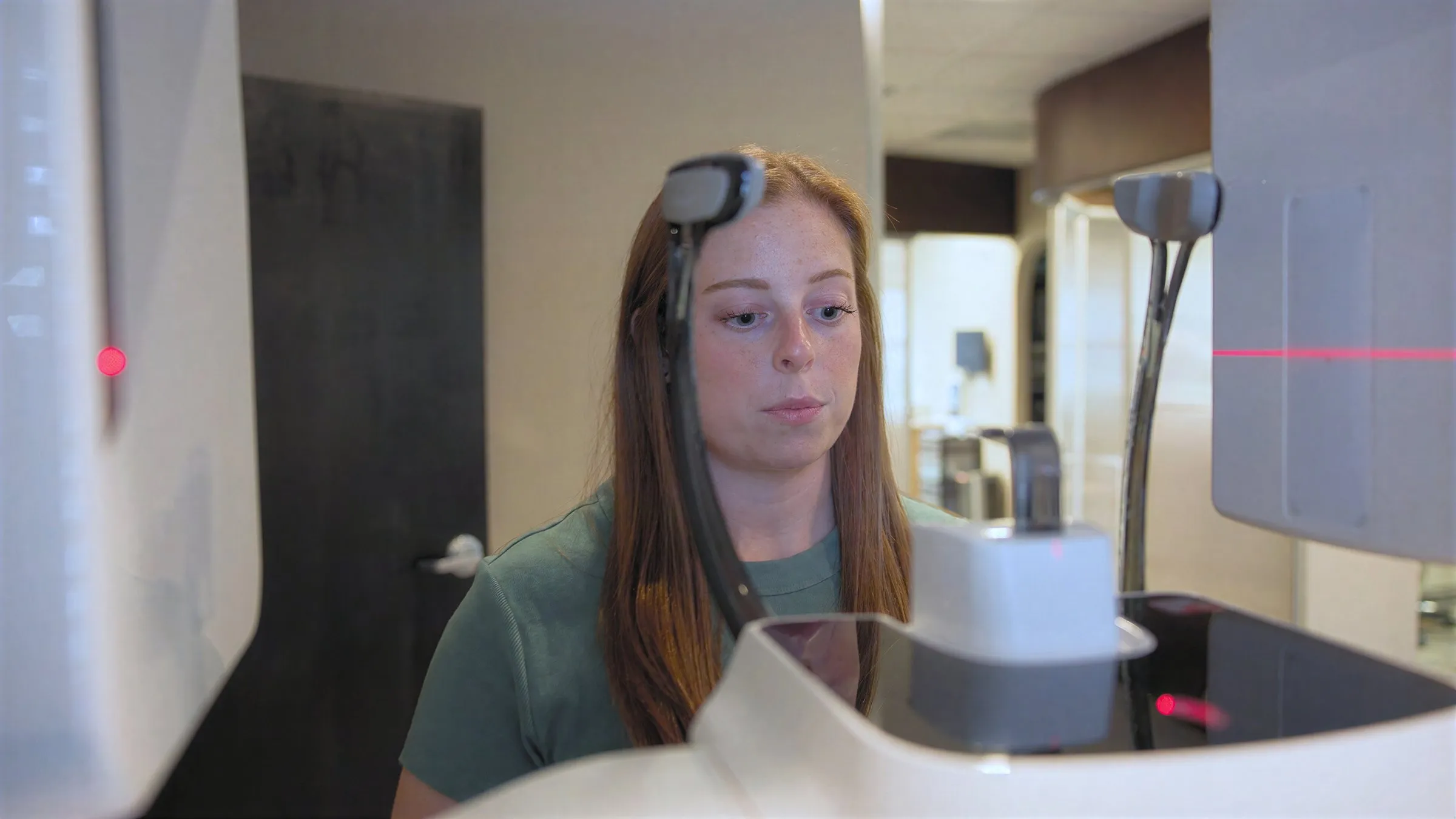 A person standing at the 3D dental scanner during an imaging appointment at Cardinal Point Dental, at a Jacksonville, FL dental office offering teeth cleanings and exams