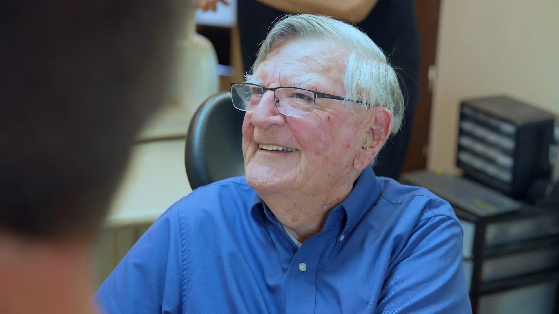 An older patient smiling during a visit at Cardinal Point Dental, a Jacksonville, FL dental office offering night guards