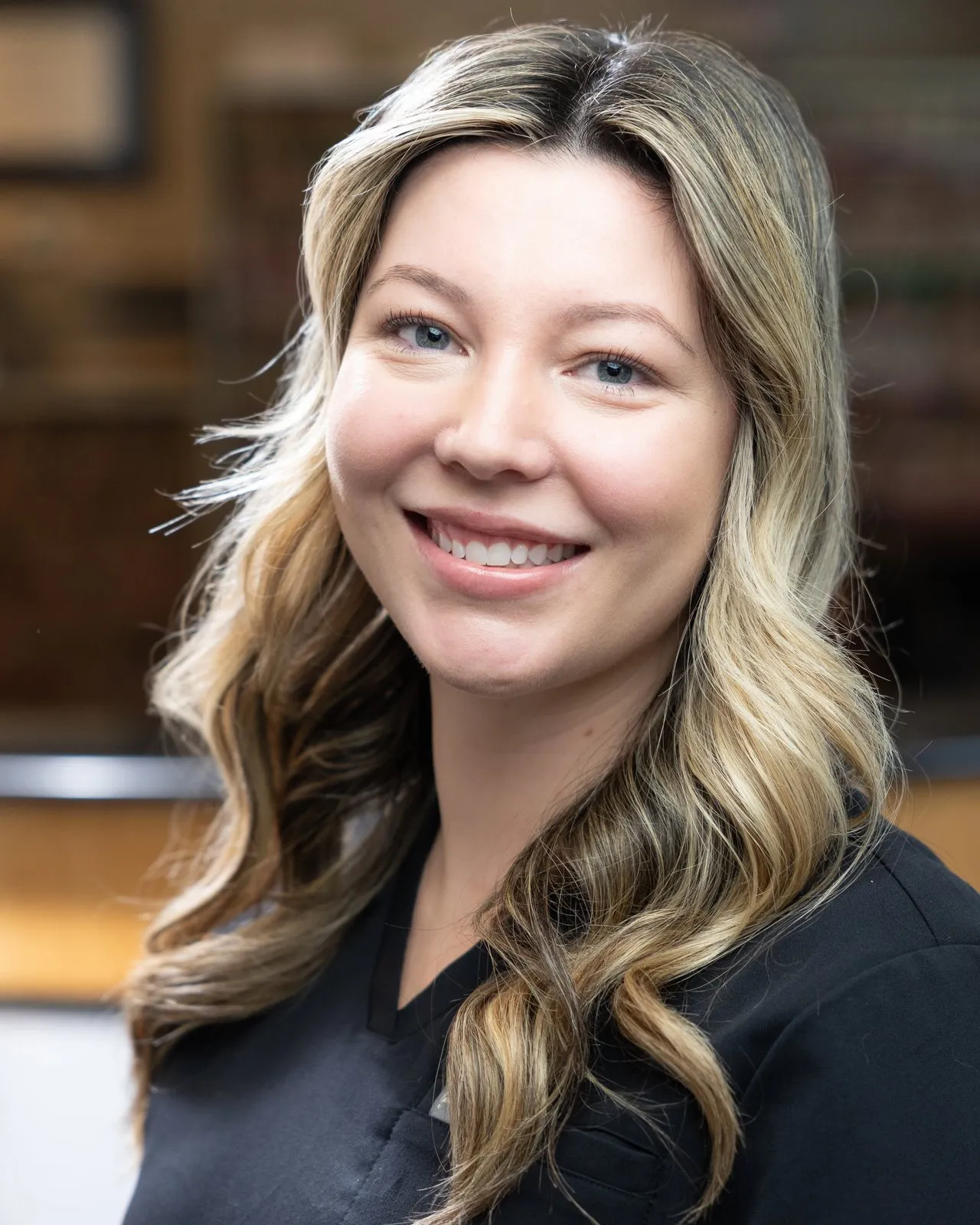 Taylor Downs, a hygienist at Cardinal Point Dental, providing teeth cleanings and exams in Jacksonville, FL